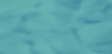 Blurred folds of teal fabric with soft, flowing textures. The abstract design creates a calming...