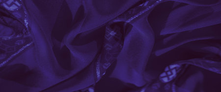 Blur: A stunning purple fabric adorned with braided embellishments and delicate geometric motifs. The layered textures and soft sheen create an elegant and opulent aesthetic.の写真素材