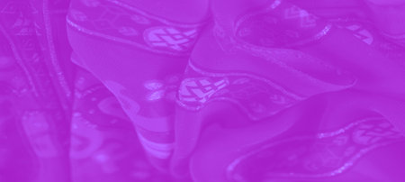 Blur: Rich purple fabric interwoven with subtle floral and lattice designs, offering a blend of...