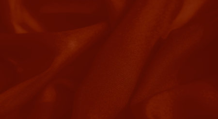 Blur unveils a dramatic red fabric with soft folds and a subtle texture, evoking elegance and sophistication, ideal for artistic compositions and refined backgrounds.の写真素材