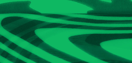 Blur of vibrant green fabric with flowing black wavy patterns. The image showcases a mesmerizing play of light and texture, creating a modern abstract design.の写真素材