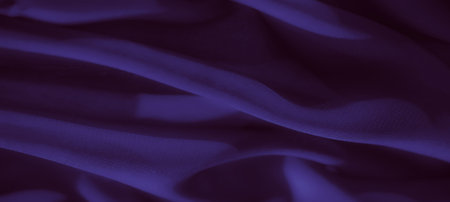 Blur. A soft, luxurious purple fabric with layered folds and gentle curves. The subtle texture and...