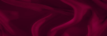 Blur. A deep red textile with elegant flowing waves and soft highlights creates a luxurious, smooth fabric appearance. The gentle curves and shadows enhance the visual depth.の写真素材