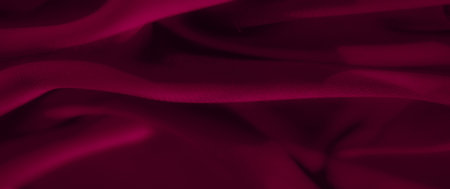 Blur - Artistic textile with soft flowing folds in a deep burgundy hue. The subtle texture and shadow create an abstract, elegant impression of luxury and style.の写真素材