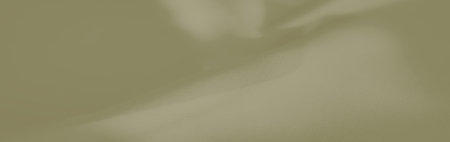 Blur, an olive-green textile featuring smooth curves and flowing folds, highlighting the soft fabric texture with gentle light reflections for elegant and abstract design uses.の写真素材