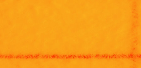 Blur A bold orange fabric featuring precise stitch work and fluid folds, creating an artistic and inviting display of texture and color depth.の写真素材