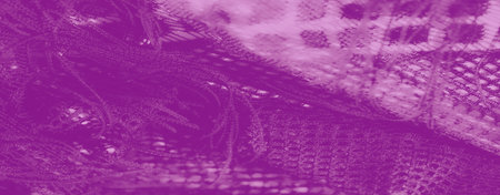 Blur of delicate purple lace fabric creates a dreamy texture with intricate mesh patterns. Soft folds add depth and subtle elegance to the textile design. Keywords:の写真素材
