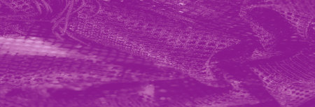 Blur of a luxurious purple lace fabric with fine mesh details, delicate folds, and a rich texture, perfect for artistic, textile, and fashion uses.の写真素材