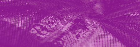 Blur of purple lace fabric with an intricate geometric design, showing its fine texture and delicate craft under diffused light, perfect for artistic textiles.の写真素材