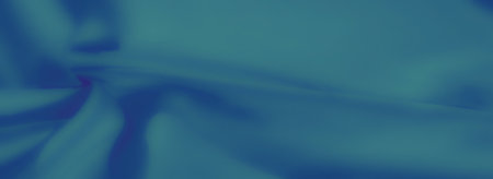 Blurred folds of smooth blue fabric, creating a soft and elegant texture with delicate shadow gradients. Perfect for backgrounds and textile design themes.の写真素材