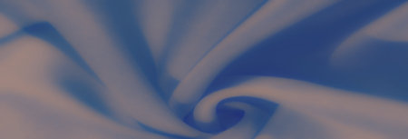 Blur of flowing blue fabric with soft folds and subtle shadows, creating a peaceful and elegant...