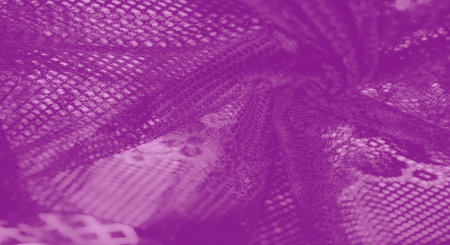 Blur of purple lace fabric, highlighting net-like texture and soft patterns, creating a luxurious, feminine, and artistic designの写真素材