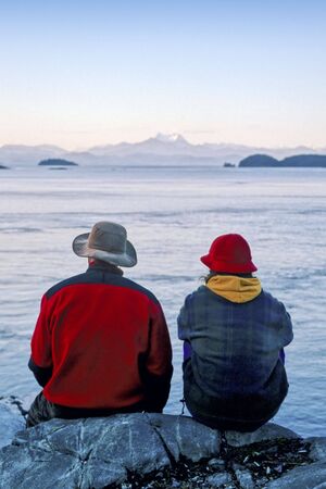 Couple looking at Ocean and Mountainsの写真素材