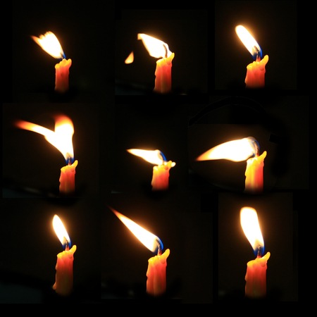 Candle light set isolated on blackの写真素材