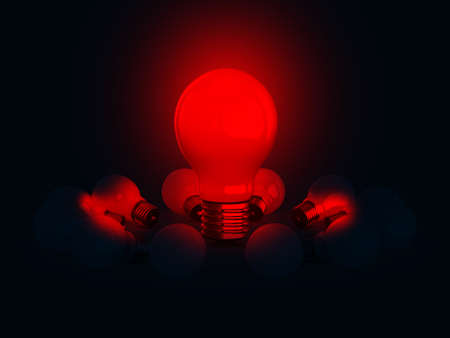 Red glowing light bulb lamp illuminates on dark.の写真素材