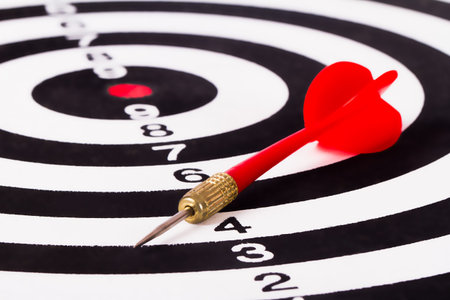Plastic, red arrow on dart board.