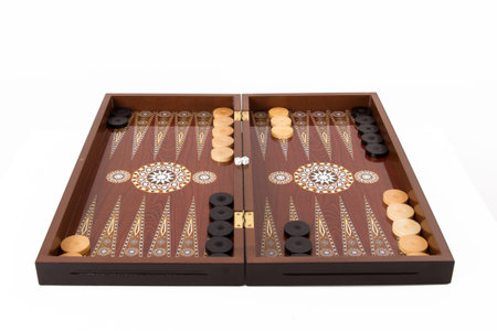 Backgammon set with table, chips and dice at the beginning, isolated on white background.