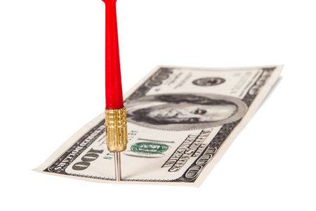 Red, plastic arrow and one hundred dollar bill, isolated on white background.の写真素材