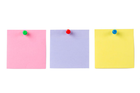 Blank, empty multi colored sticky post it pinned on white isolated background.