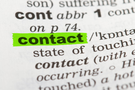 Contact word highlighted with green marker on dictionary page.