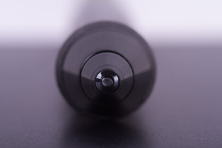 Focused on digital graphic pen point on tablet with depth of field.の写真素材