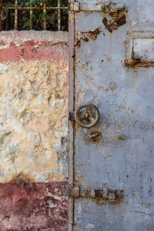 View of rusty, iron prison door.の写真素材