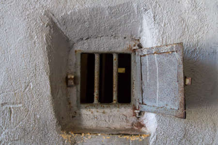 Rusty, old, open, steel window.の写真素材