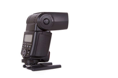 Electronic external speedlight, back view, isolated on white background.の写真素材