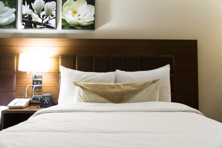 Interior of modern hotel bedroom and glowing light.