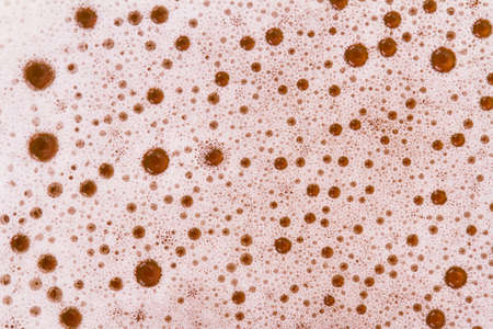 Close up view of beer foam, top view.の写真素材