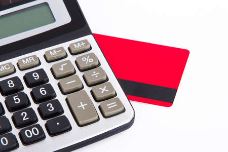 Credit card and calculator, isolated on white background.の写真素材