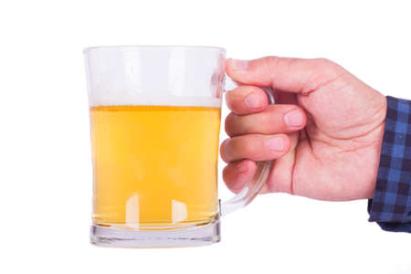 Hand holding full beer glass, isolated on white background.の写真素材