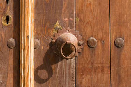 Close up of a lock or latch of wooden door gate.の写真素材