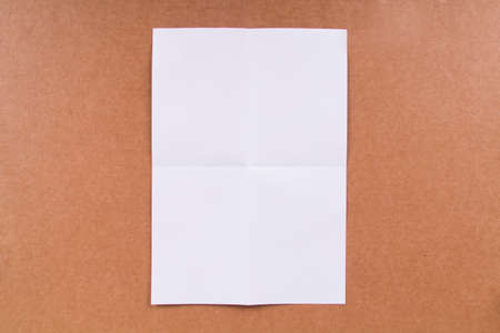White, blank, empty folded paper on background.の写真素材