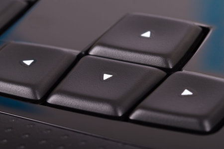 Arrow keys on black keyboard.