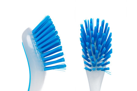 Blue brush for cleaning, front and side view, isolated on white background.