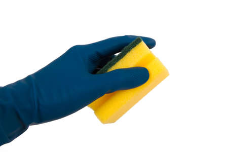 Hand with blue glove holding yellow cleaning sponge, isolated on white background.の写真素材