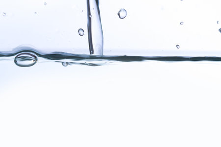 Close up view of water splash, isolated on white background.