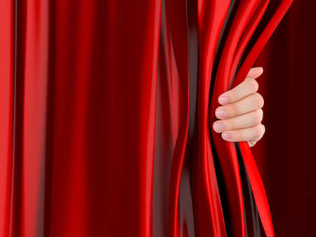 Hand opening red curtain.の写真素材