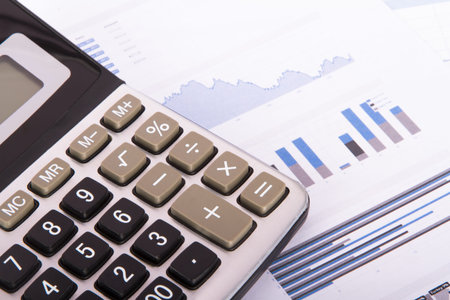Calculator on financial data graphs.の写真素材