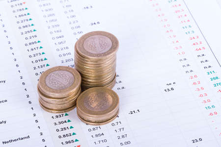 Coins on financial data analysis.の写真素材
