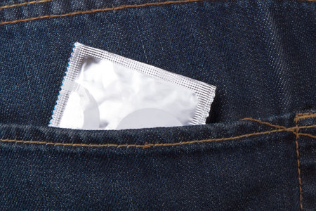 Condom packet in jeans pocket for safe sex.の写真素材
