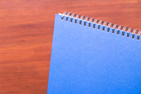 Desk close up view of calendar mock up template on wooden table.の写真素材