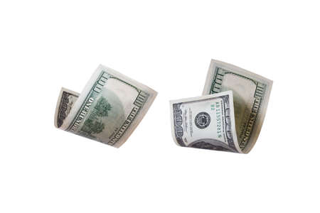 One hundred dollar banknotes flying, isolated on white background.の写真素材