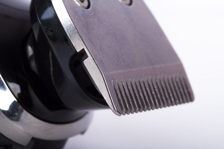 Close up view of electric shave machine, isolated on white background.