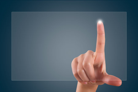 Young female hand finger touching or pressing on digital screen on dark background with copy space...