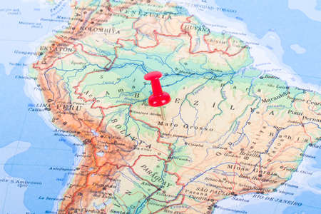 Red pushpin on mapの写真素材