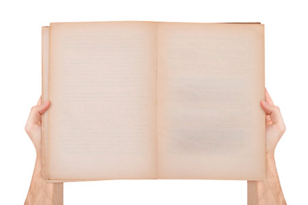 Male hand holding blank empty open and old style book with copy space for your message, top view,...