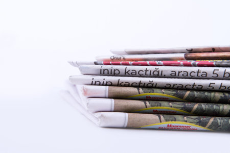 Stack of newspapers, isolated on white background.