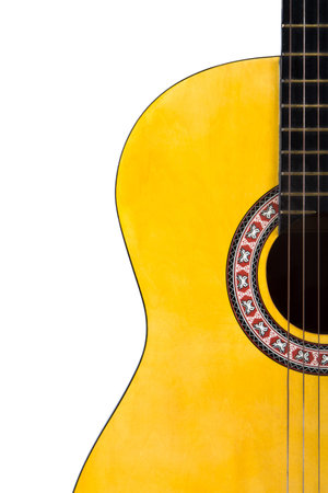 Detail view of yellow wooden classical acoustic guitar, isolated on white background.